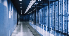 Room filled with servers in data centre, photo has blue hues